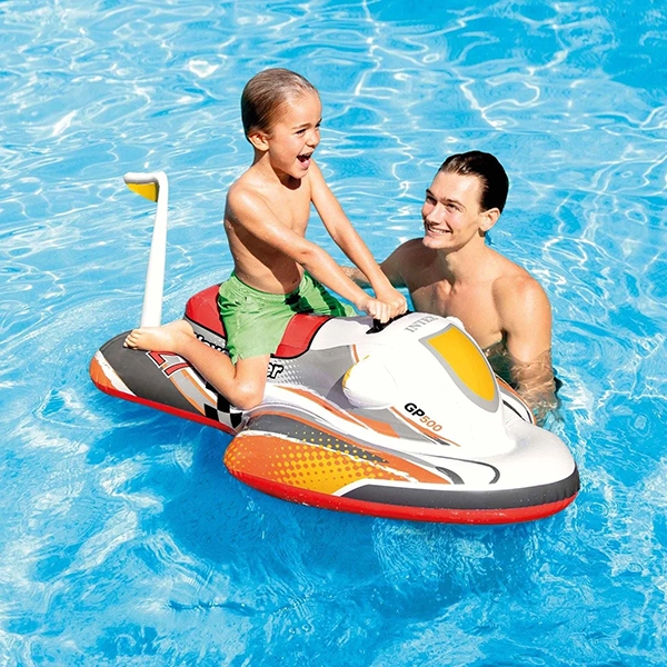 Child riding the Wave Rider Ride-On inflatable pool toy in the water with an adult assisting