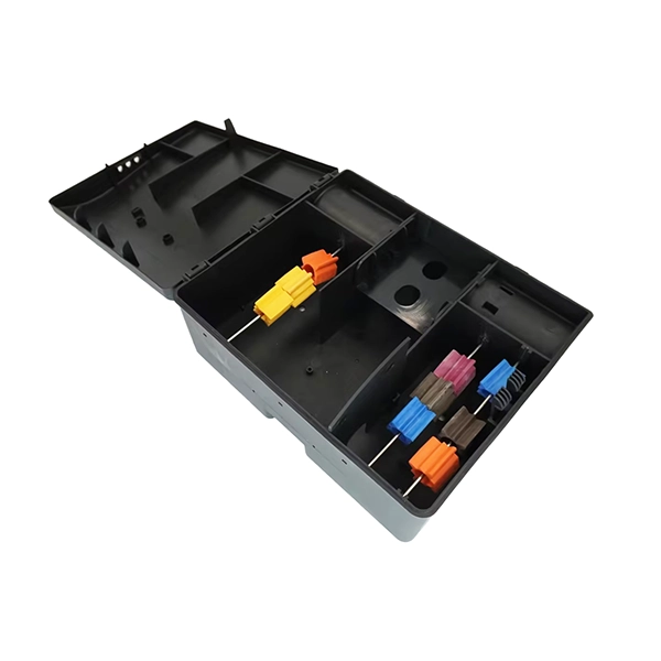 Open rodent bait station with organized compartments, containing multiple color-coded bait blocks for targeted pest control.