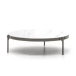 Round coffee table with a marble top and sleek metal legs.