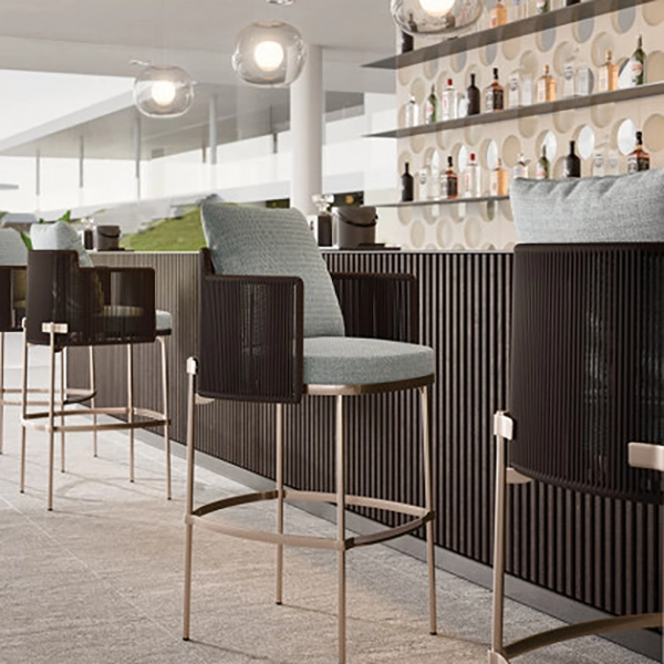 Solenne outdoor bar stools with woven backrests and cushioned seats