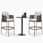 Solenne Disc Base Bar Table paired with two outdoor bar stools