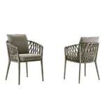 Two Pietra outdoor dining chairs with woven backrests and cushioned seats