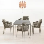 Pietra outdoor dining set featuring four woven-back chairs and a rectangular dining table