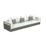 Elegant three-seater outdoor sofa with woven rattan frame and plush cushions.