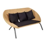 Stylish Elysium Rattan Outdoor Three-Seater Sofa with natural rattan finish and plush black cushions.