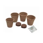 "Components of the RHS Forget-me-not Grow Kit, including biodegradable pots, soil pellets, and seed packet.