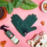 We The Wild Leaf Health Duo kit with plant care spray and green gloves, displayed with leaves and crystals for leaf maintenance.