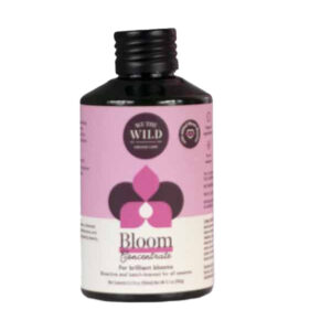 We The Wild Bloom plant nutrient bottle, designed to support flowering and boost plant blooms.