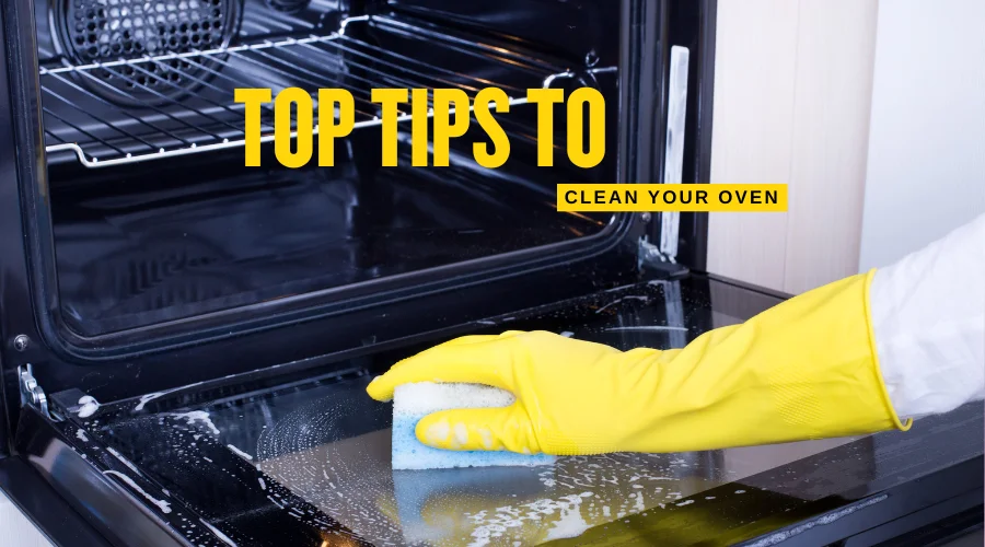 Person cleaning an oven interior using enzyme product and a sponge.